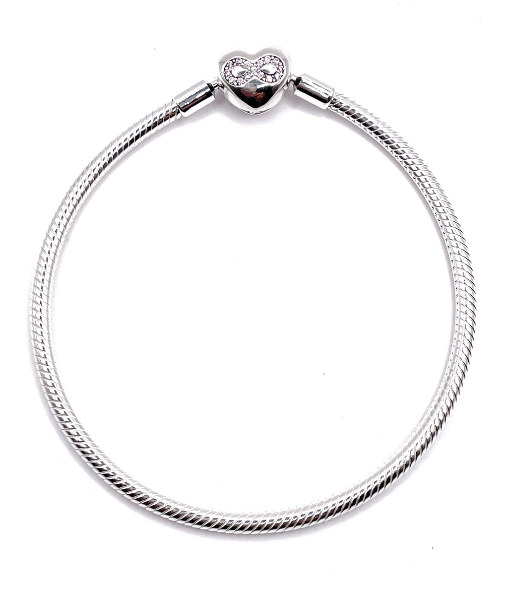 Pulsera flexible broche corazón infinito rosa