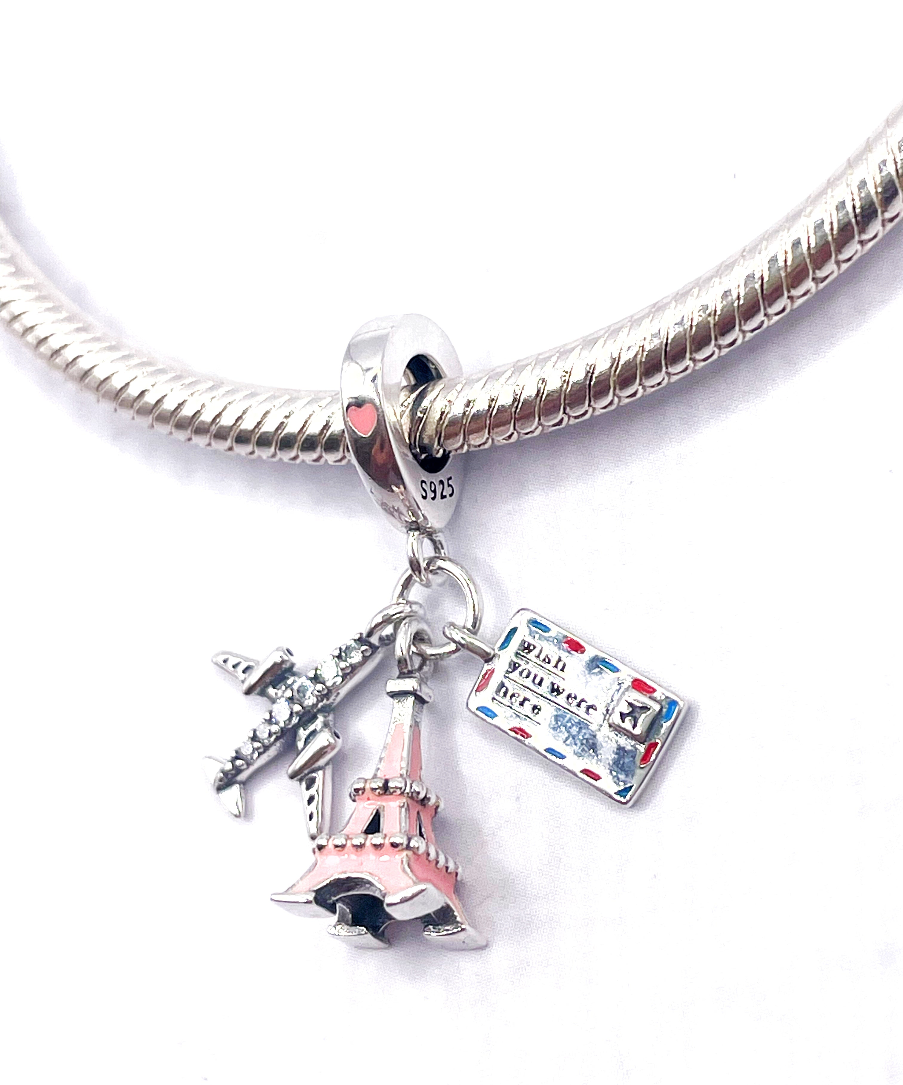 Charm Avión, Torre Eiffel rosada y postal