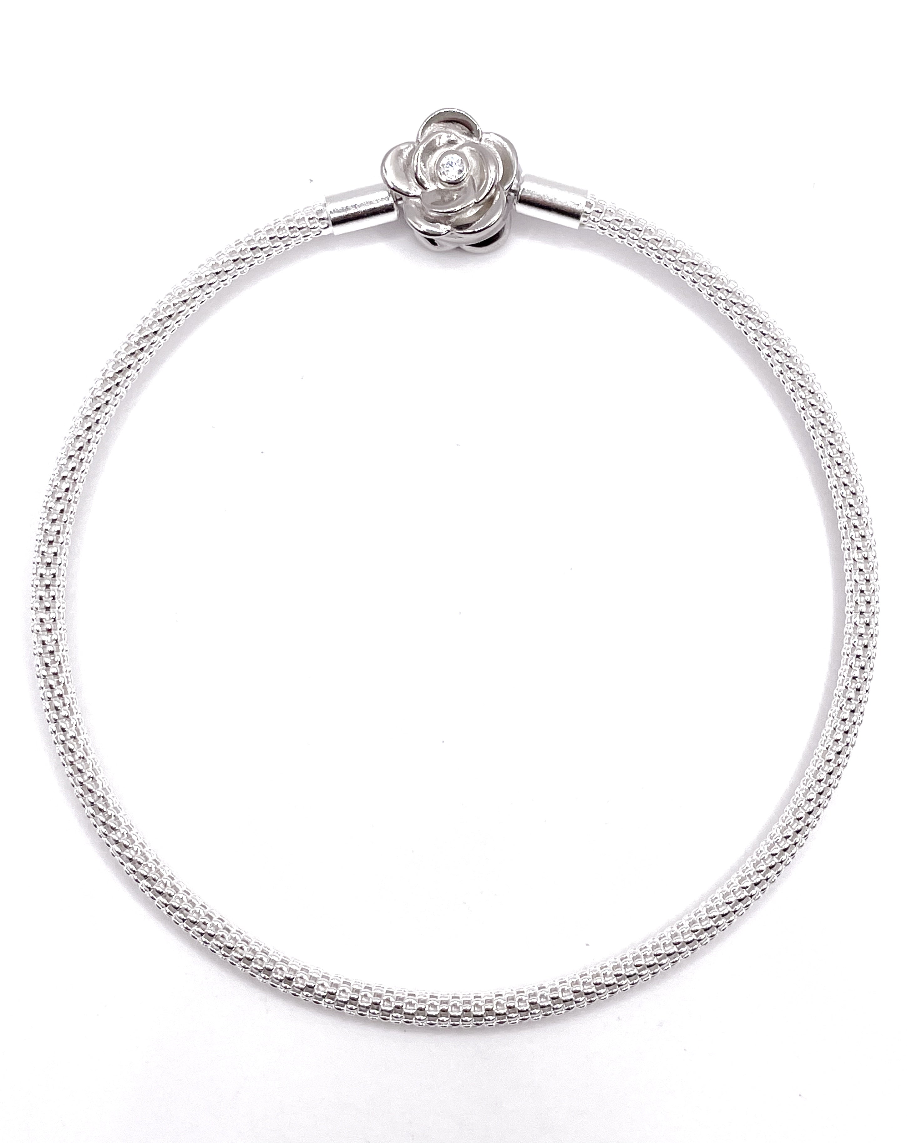 Pulsera rígida broche rosa