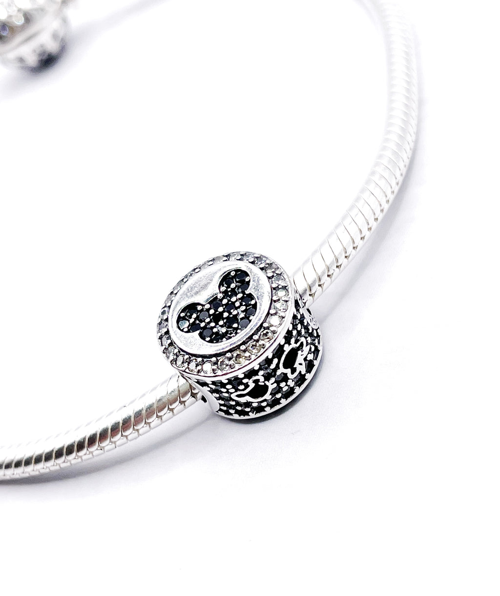 Charm M&M cabezas en circonias con borde de circonias