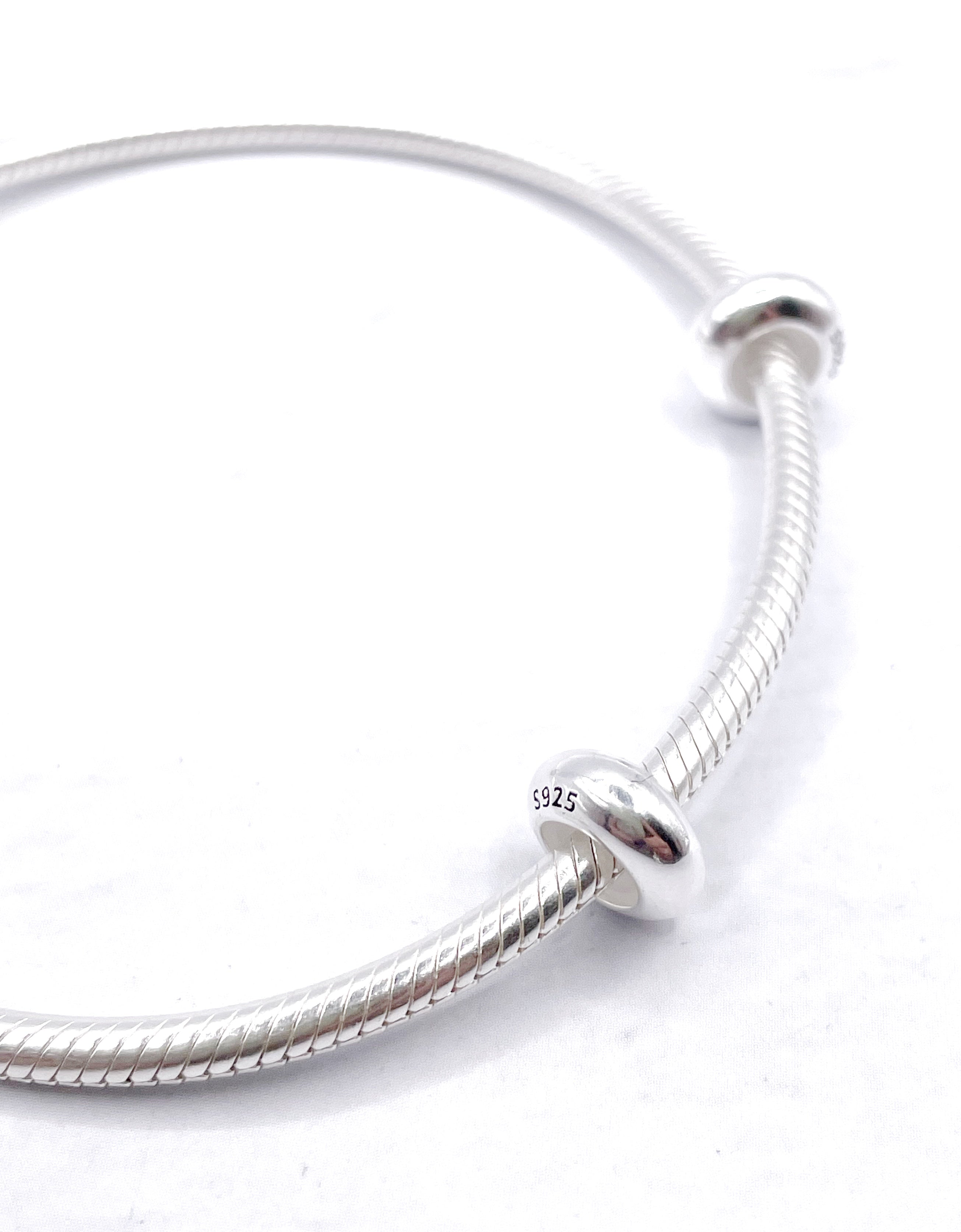 Charms Par de Fijadores lisos