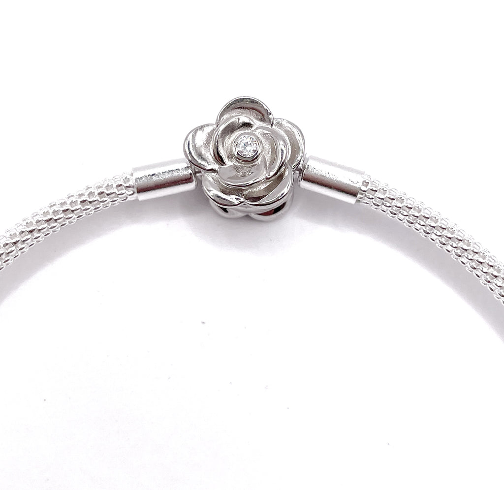 Pulsera rígida broche rosa