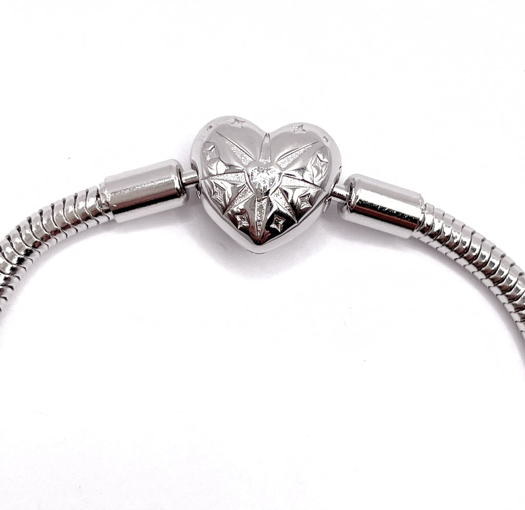 Pulsera flexible broche corazón brújula