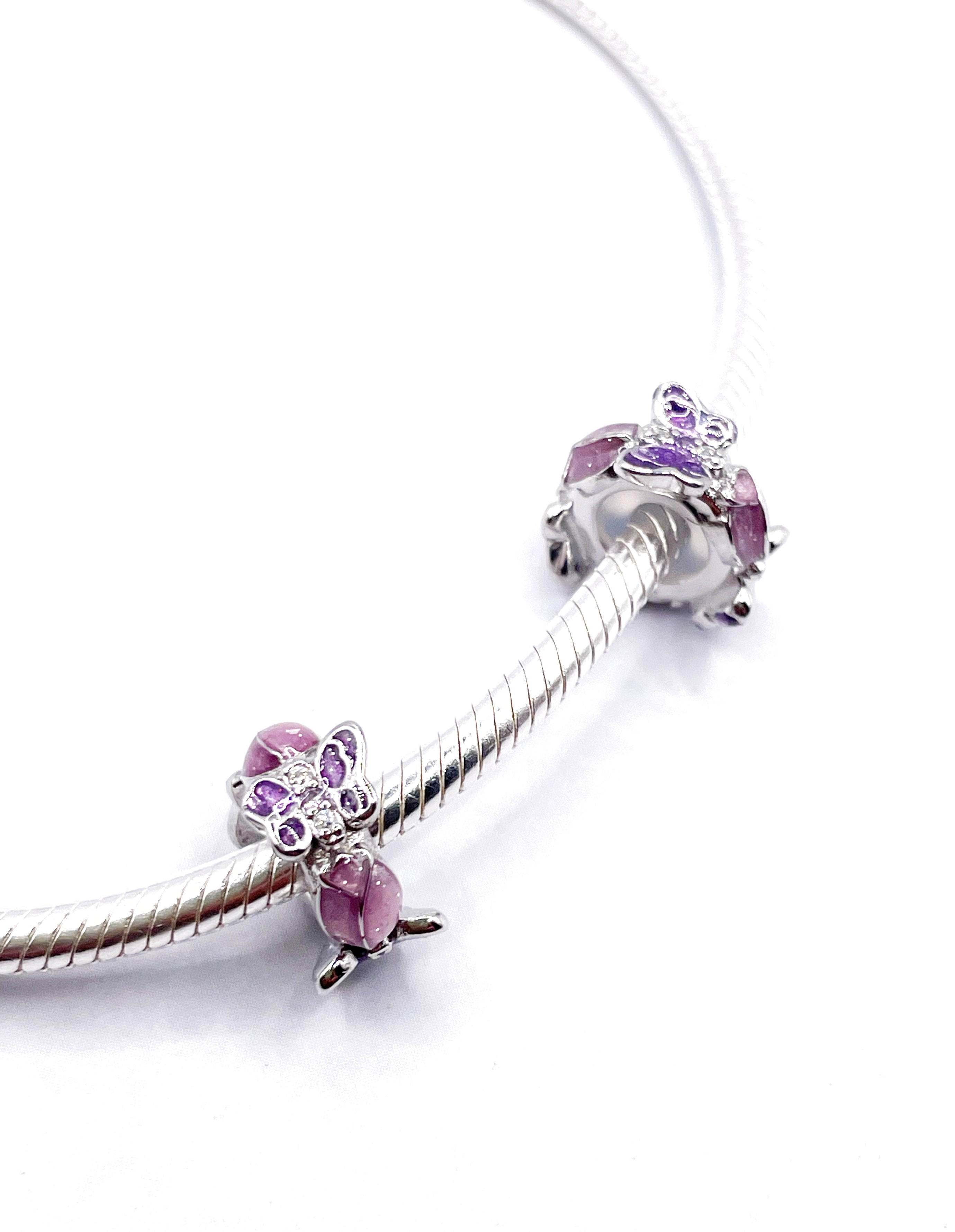 Charms Par de Fijadores de piedras y mariposas con circonias lilas