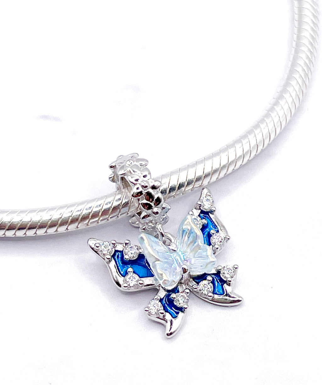 Charm Mariposa doble azul y tornasolada