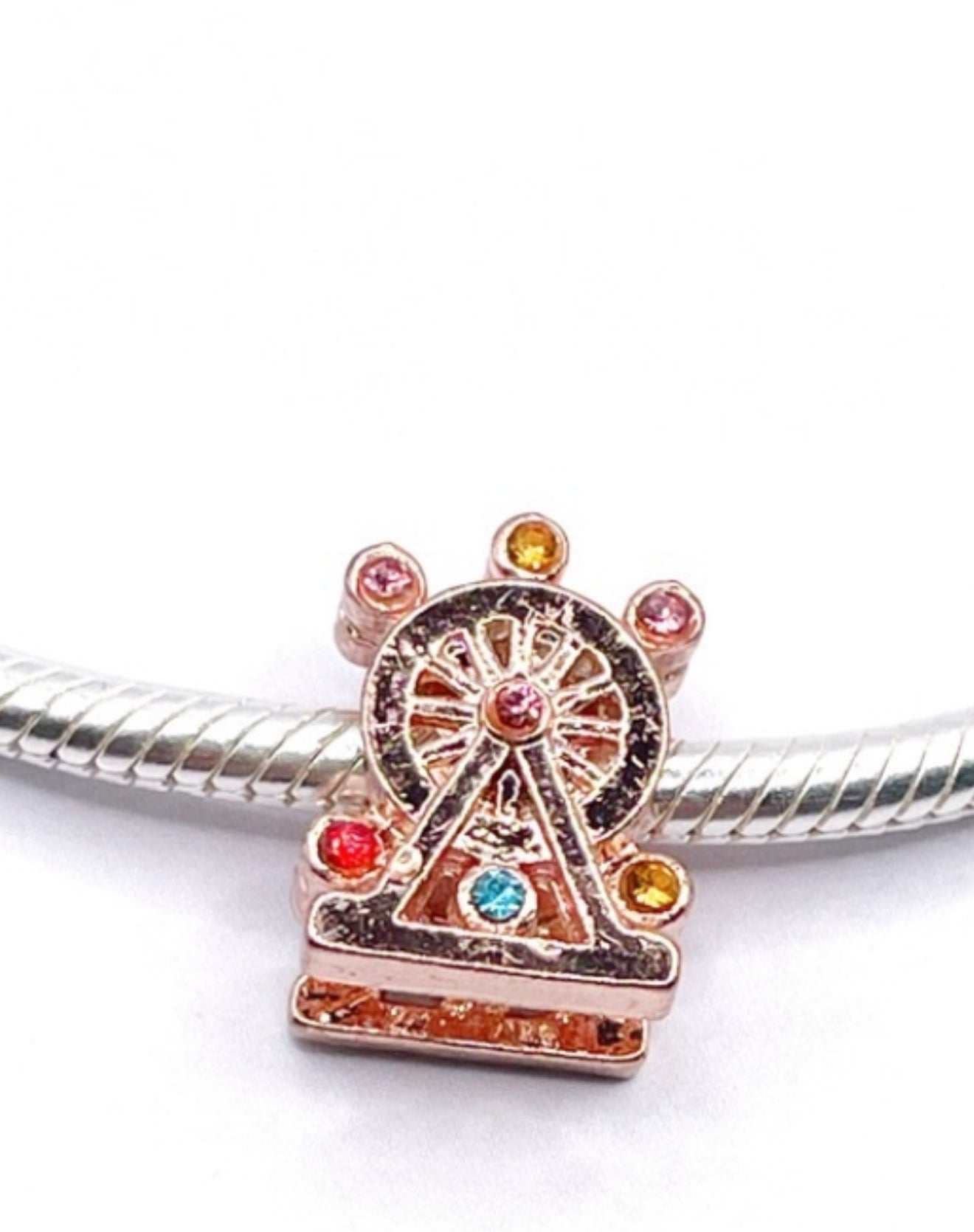 Charm Carrusel con circonias rose gold