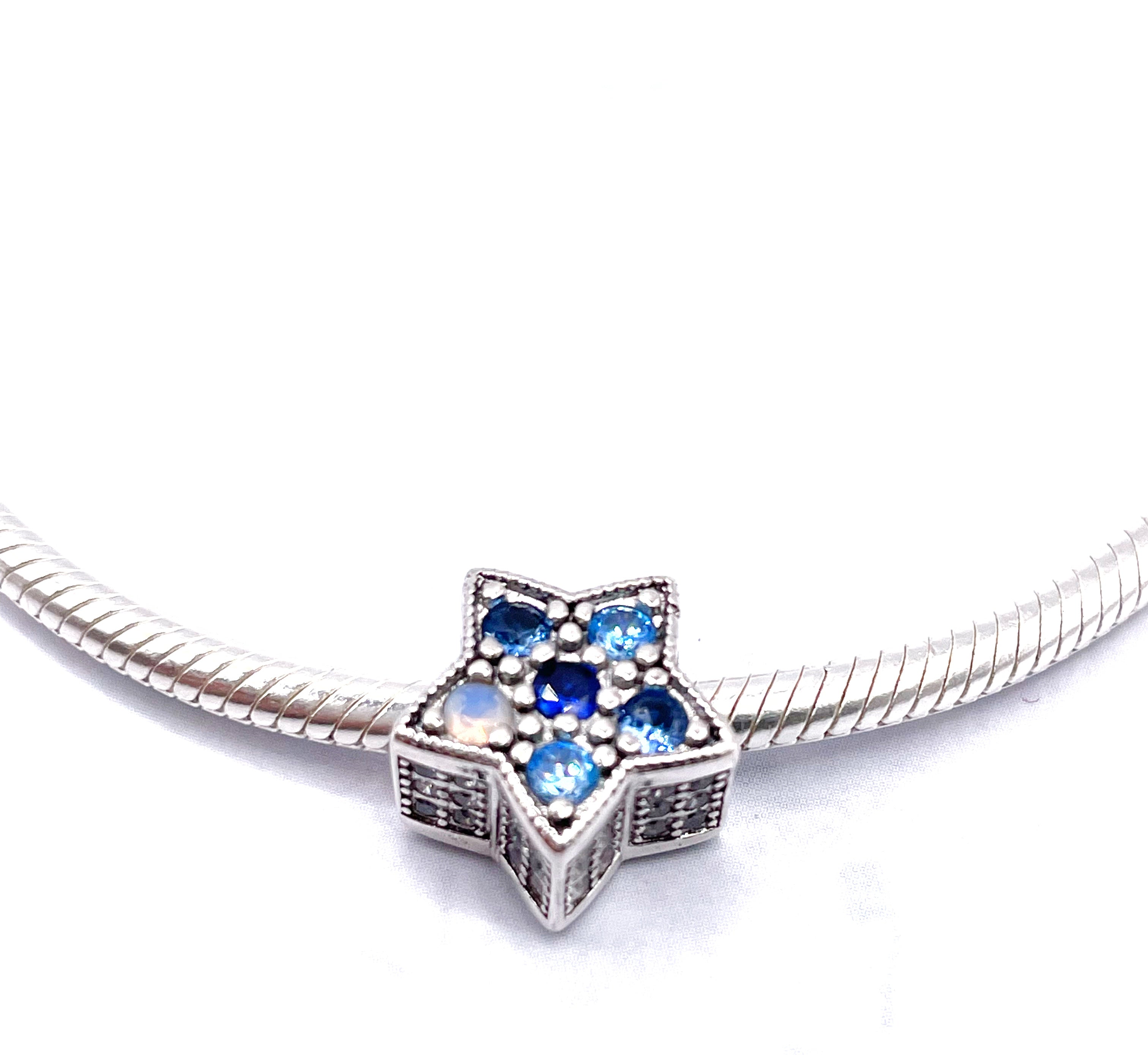 Charm Estrella de circonias en tonos azules