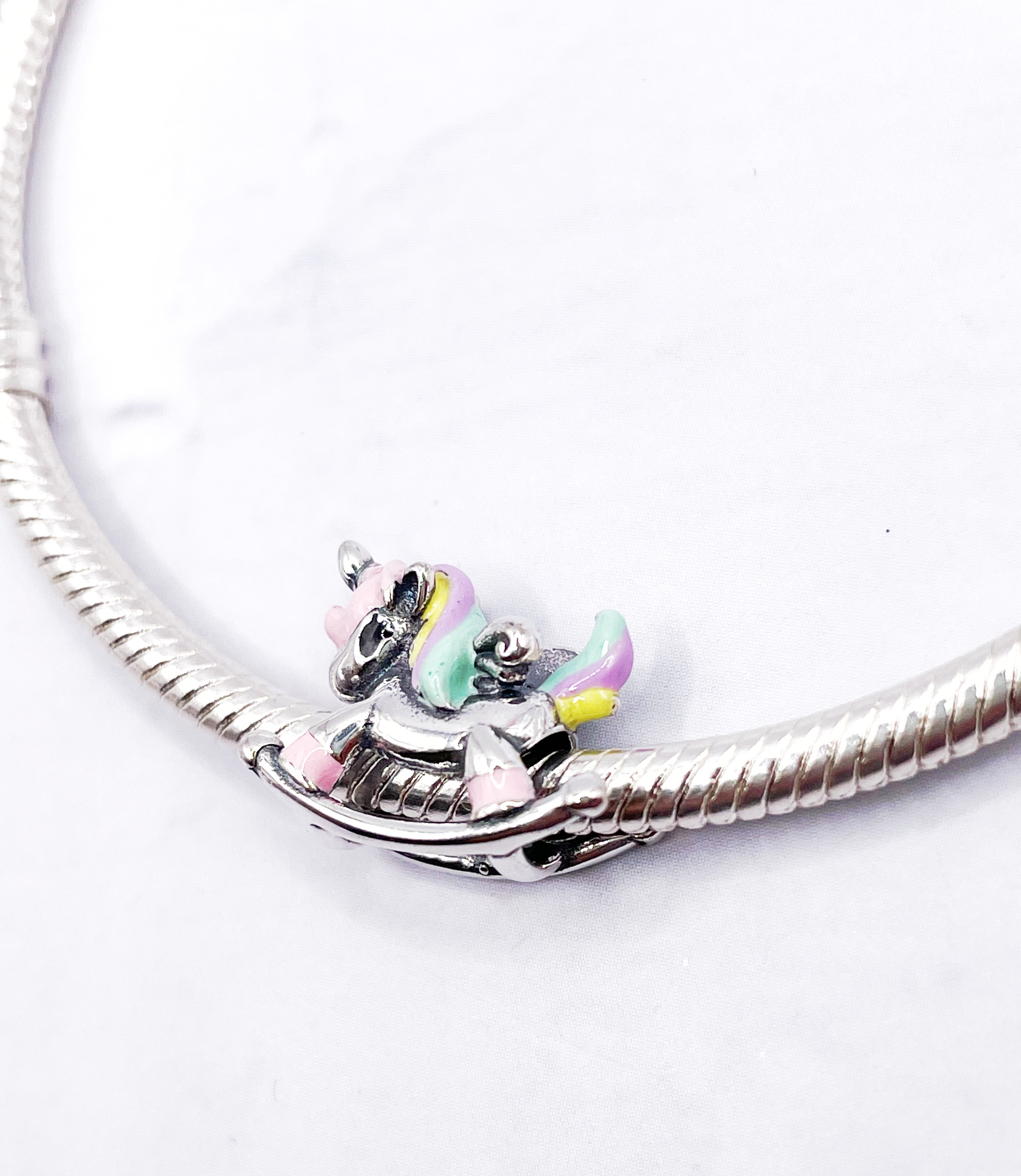 Charm Unicornio balancín