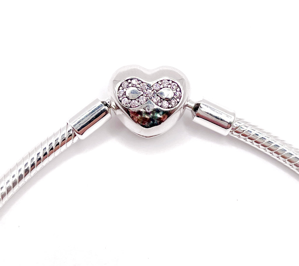 Pulsera flexible broche corazón infinito rosa