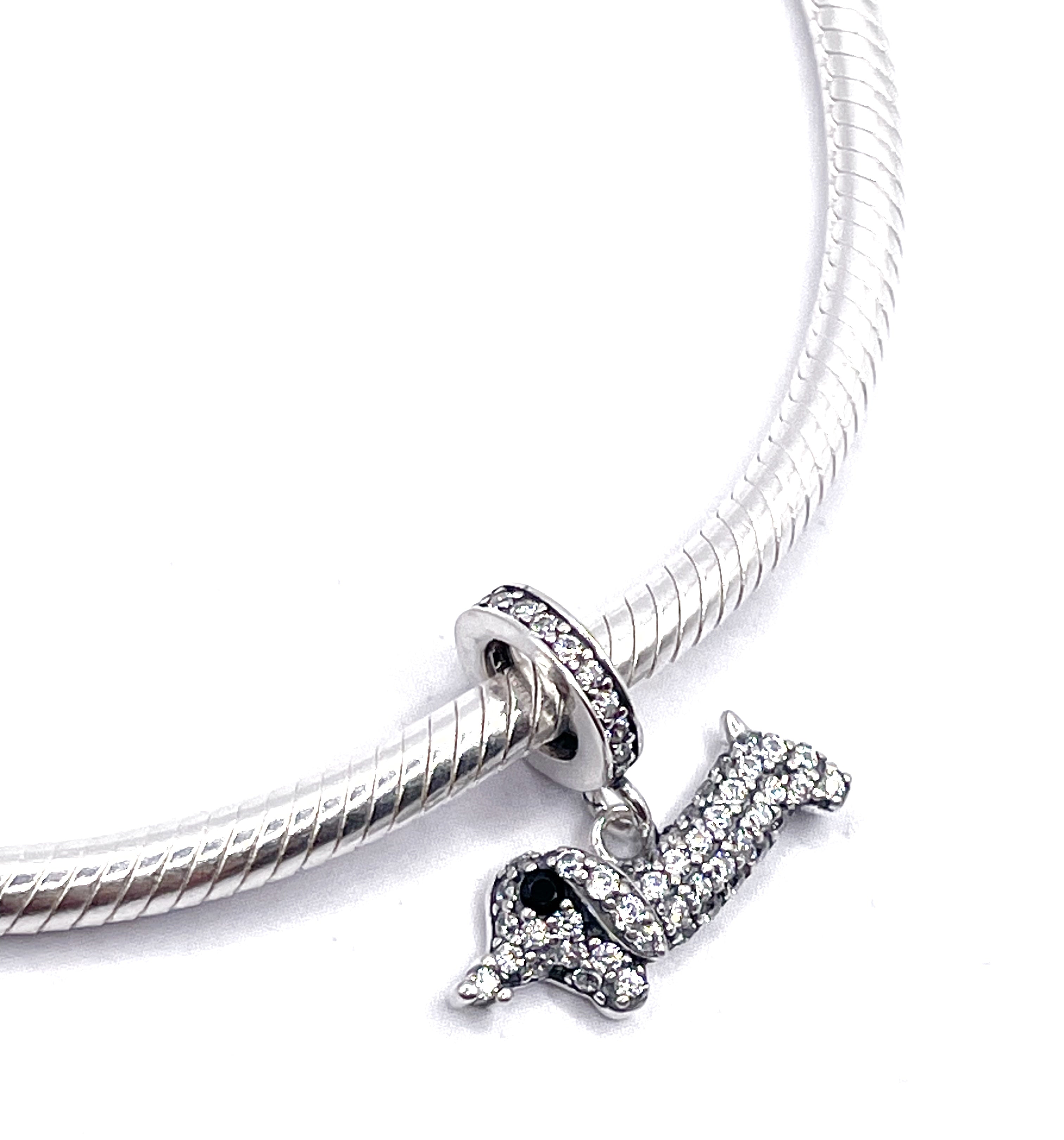 Charm Salchicha de circonias