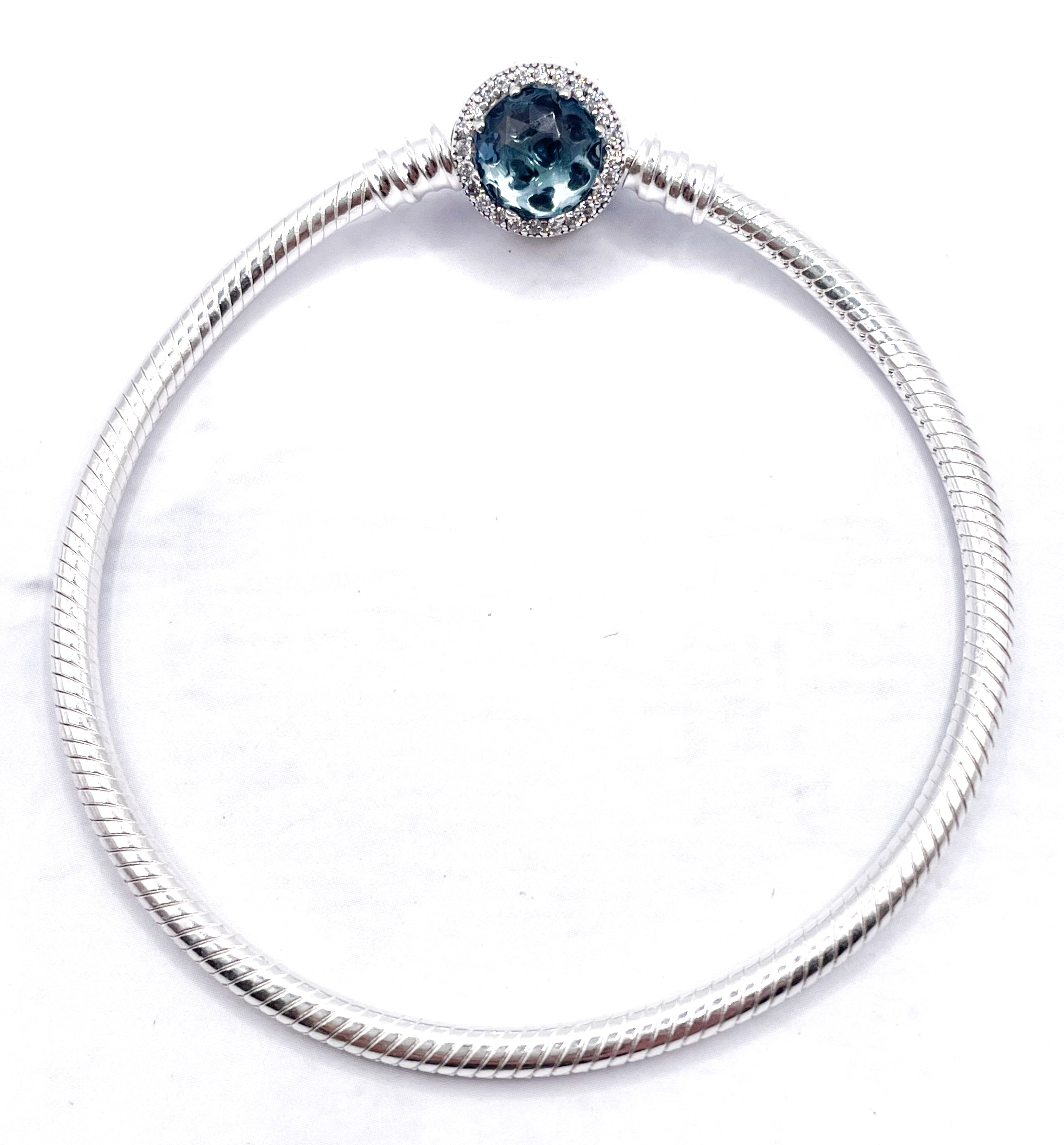 Pulsera flexible broche disco celeste de circonias