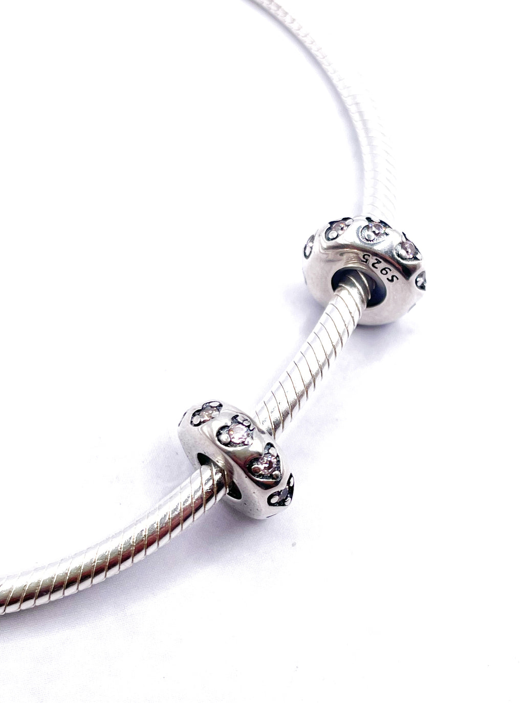 Charms Par de Fijadores de corazones con circonias rosadas