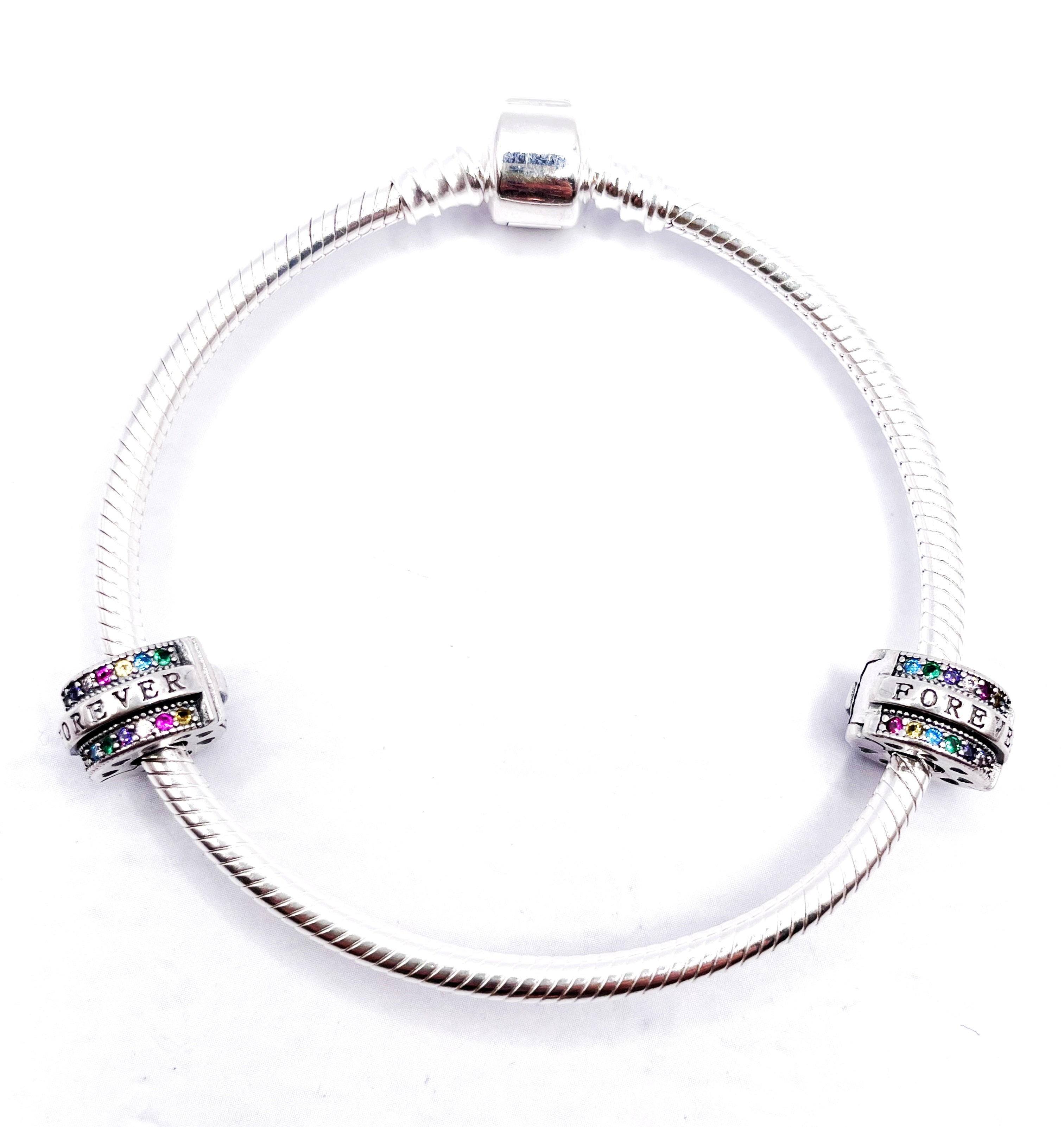 Charms Par de Fijadores clip Forever con bordes de circonias multicolores