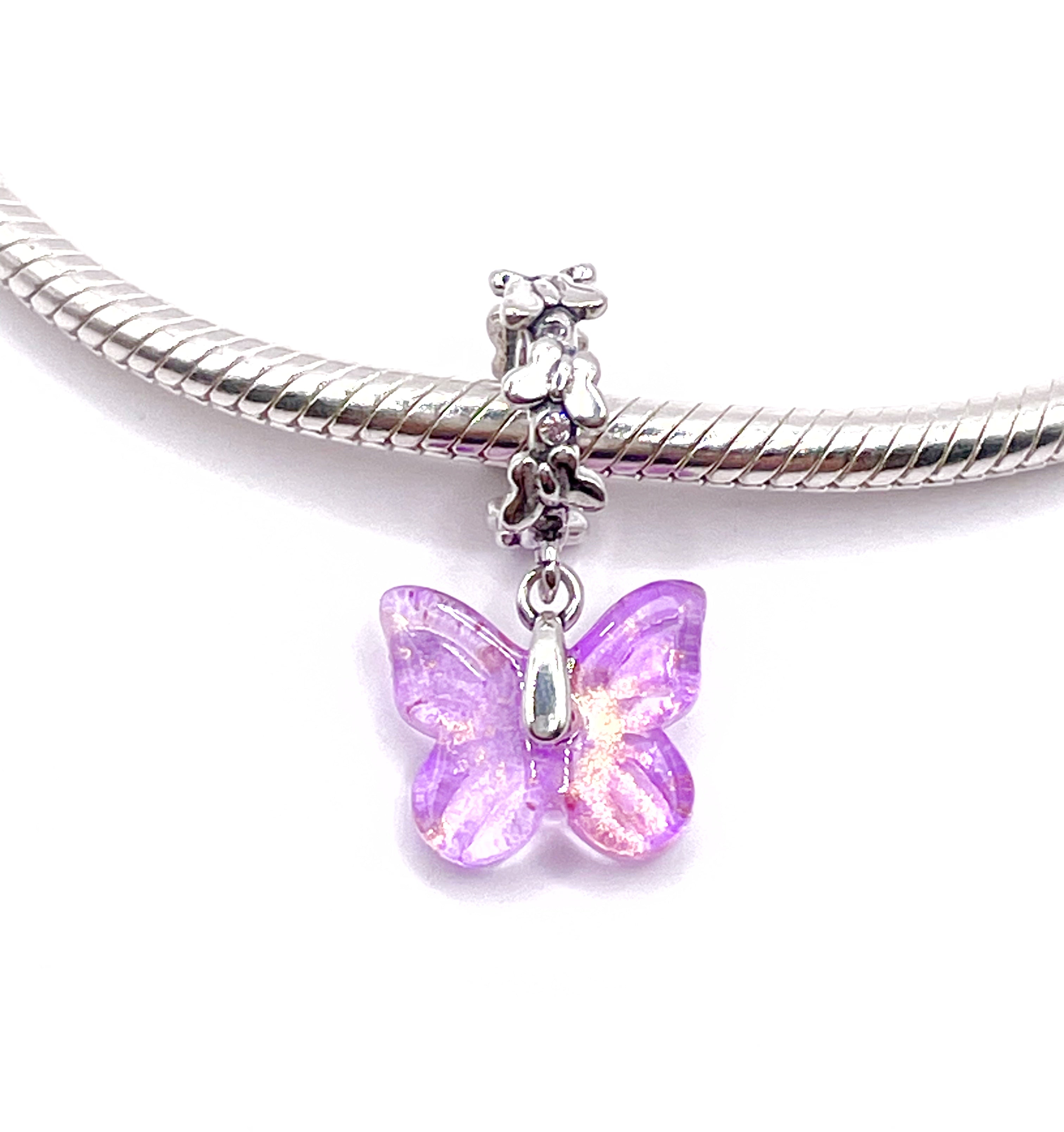 Charm Mariposa lila transparente